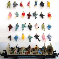 Figuren sitzende Reisende